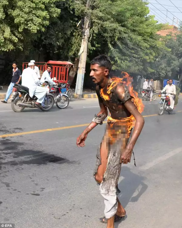 Pakistani Man Runs Through The Streets Covered In Flames After Setting Himself On Fire As A Against The Taxman